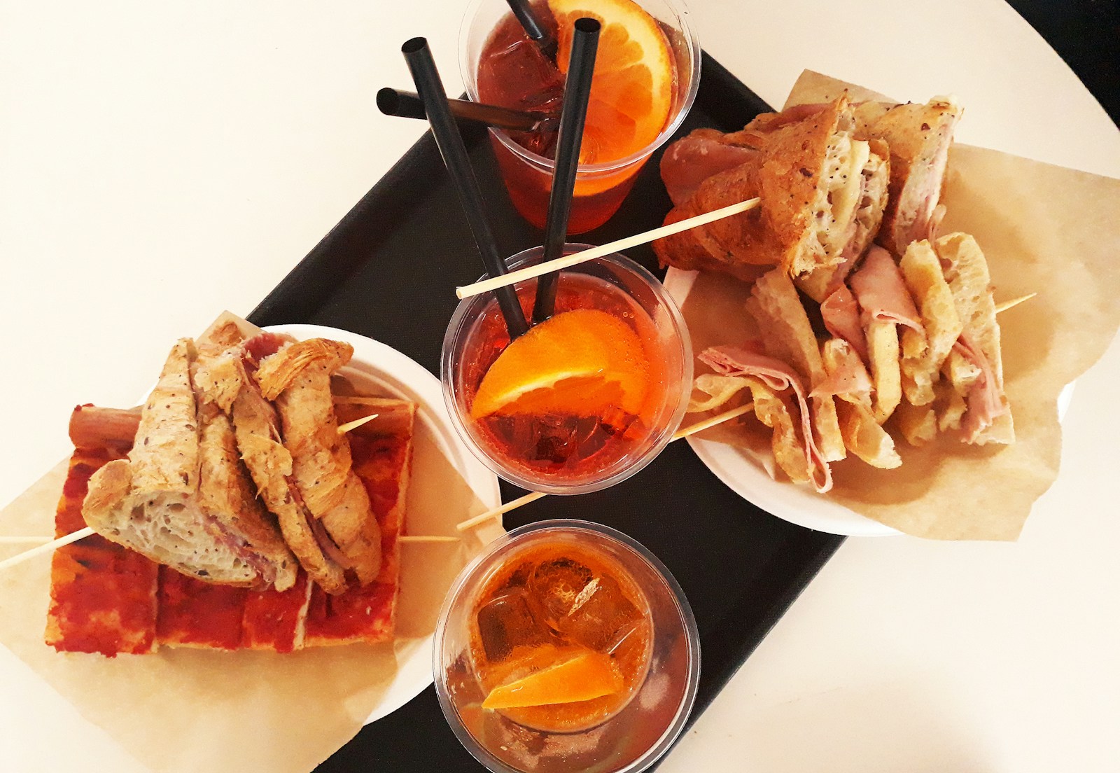 a black tray topped with different types of food